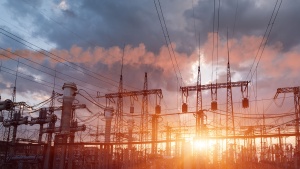 Thermal power stations and power lines during sunset.
