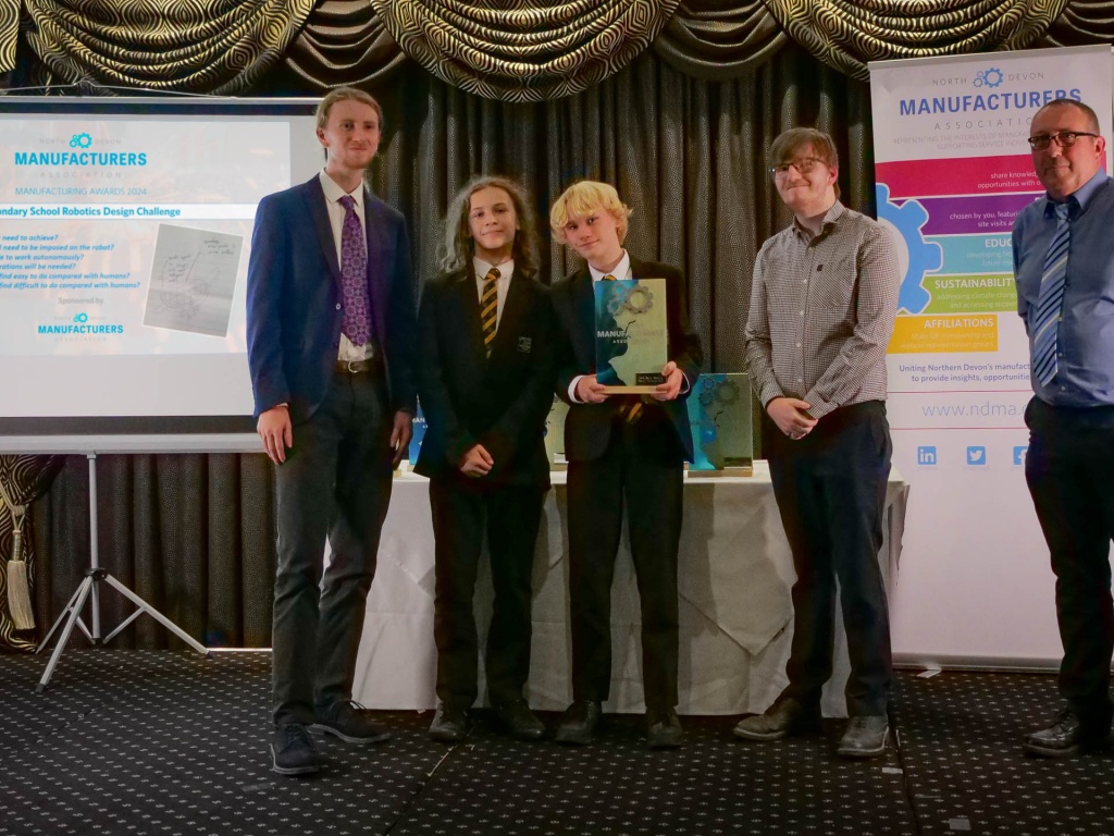 Queen Elizabeth School Crediton receiving the winning trophy for the NDMA Robotics Design STEM challenge 2024